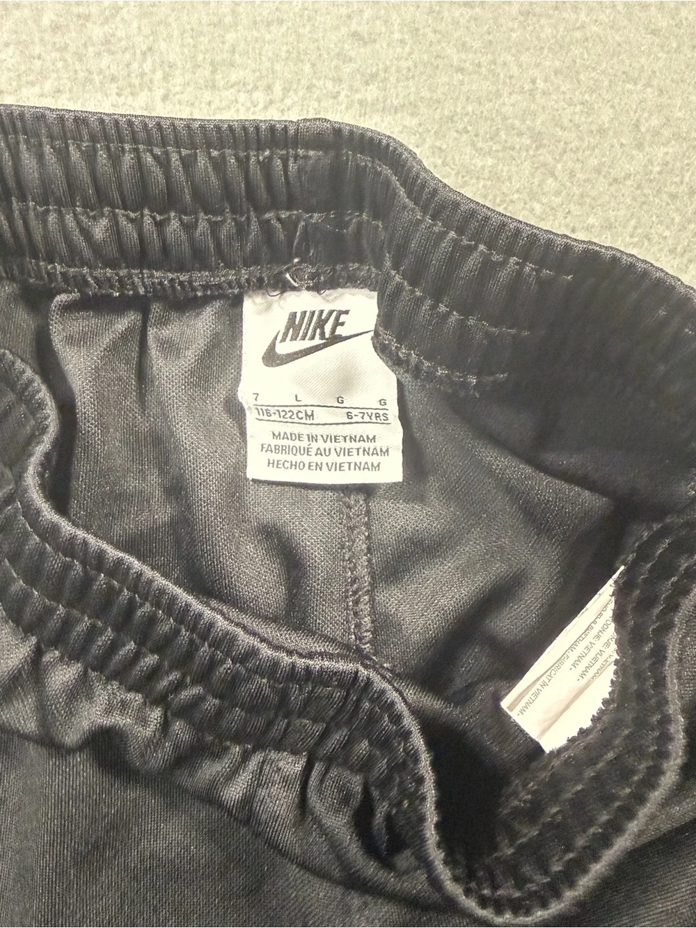 Nike Black Youth Athletic Shorts with Red Logo